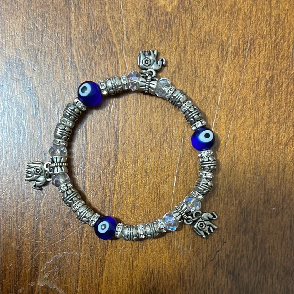 Silver and Blue Beaded Evil Eye Bracelet with Good Fortune Charms